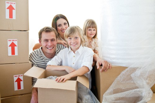 Professional movers carrying furniture during house removals